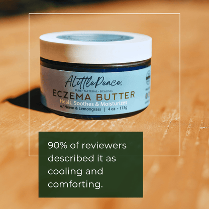ALittlePeace Eczema Body Butter jar on a wooden surface with text about reviews.
