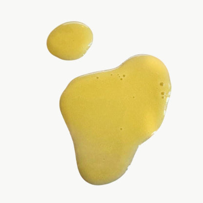 ALittlePeace Moisture Retention Shampoo swatch with a smooth, yellow‑tinted gel on a clean light background, highlighting its nourishing formula.