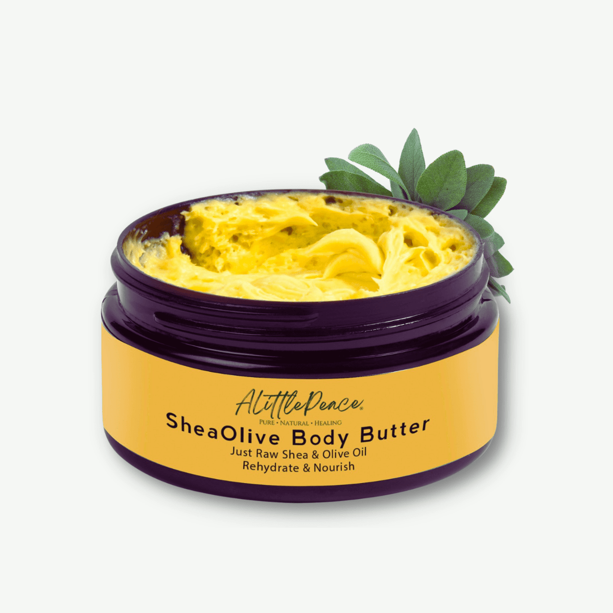 ALittlePeace SheaOlive Body Butter — open jar of rich, light‑yellow shea and olive moisturizer for dry, sensitive skin, shown with olive leaves on a soft light background.