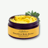 ALittlePeace SheaOlive Body Butter — open jar of rich, light‑yellow shea and olive moisturizer for dry, sensitive skin, shown with olive leaves on a soft light background.